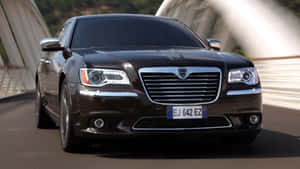 Lancia Thema Black Sedanon Road Wallpaper