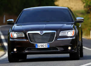 Lancia Thema Cruising On The Highway Wallpaper