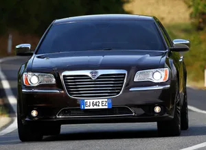 Lancia Thema Cruising On The Highway Wallpaper
