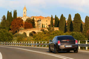 Lancia Thema Scenic Drive Wallpaper