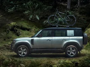 Land Rover Defender Conquering Rugged Terrain Wallpaper