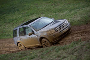 Land Rover Freelander Conquering Off-road Terrain Wallpaper