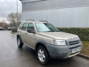 Land Rover Freelander Traversing An Off-road Terrain Wallpaper