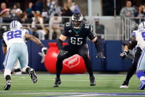 Lane Johnson Facing Defensive Opponents During Game Wallpaper