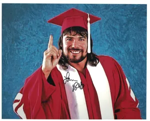 Lanny Poffo Professional Wrestler Gesturing A Point Upwards Wallpaper