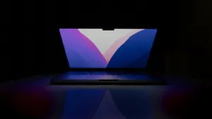 Laptop Illuminatedin Darkness Wallpaper