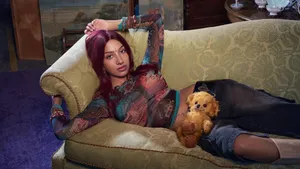 Lara Katseye Relaxing With Puppy Wallpaper