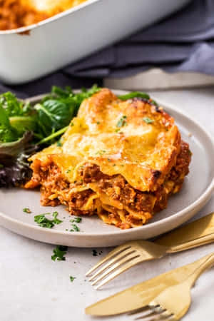 Lasagna Alla Bolognese With Gold Cutlery Wallpaper