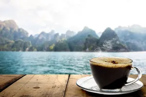 Last Light Of The Day Cascading Over A White Sand Beach Wallpaper
