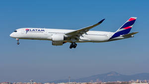 Latam Airplane Flying Over Blue Sky Wallpaper