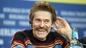 Laughing Willem Dafoe Wallpaper