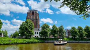 Leeuwarden Canal Viewwith Historic Church Wallpaper
