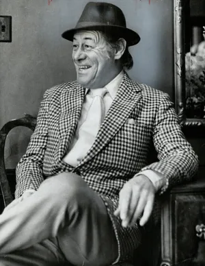 Legendary Actor Rex Harrison Radiates Joy And Laughter Wallpaper