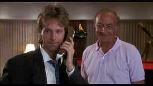 Legendary Actor Robert Loggia With Comedian Dana Carvey Wallpaper