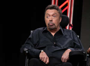 Legendary Actor Tim Curry In An Iconic Pose. Wallpaper