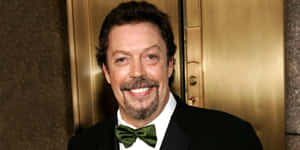 Legendary Actor Tim Curry Posing For A Portrait Wallpaper