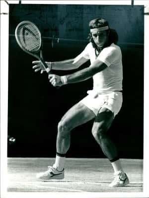 Legendary Argentine Tennis Star Guillermo Vilas In Action Wallpaper