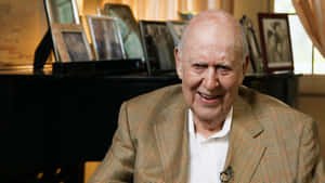 Legendary Carl Reiner Smiling For The Camera Wallpaper