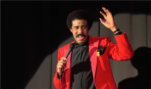 Legendary Comedian Richard Pryor In Action Wallpaper