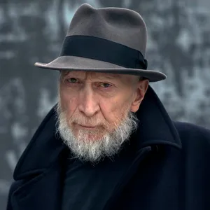 Legendary Comic Artist Frank Miller In Action Wallpaper