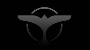 Legendary Dj Tiesto With His Signature Bird Emblem Wallpaper