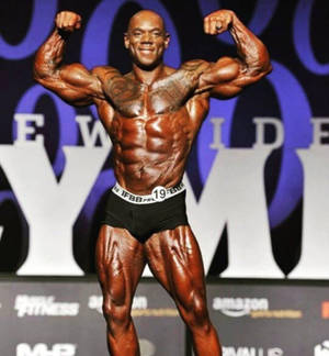 Legendary Flex Wheeler Displaying His Muscular Physique Wallpaper