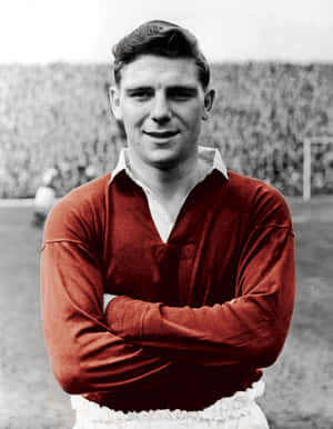 Legendary Football Player Duncan Edwards In Red Wallpaper