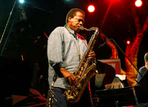 Legendary Jazz Musician Wayne Shorter On Stage Wallpaper