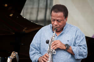 Legendary Jazz Musician Wayne Shorter Playing Saxophone Wallpaper