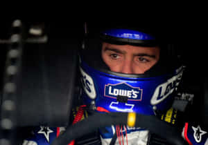 Legendary Nascar Driver Jimmie Johnson In Action On The Race Track Wallpaper