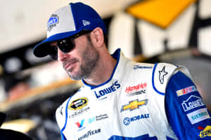 Legendary Nascar Driver, Jimmie Johnson, In The Heat Of The Race Wallpaper