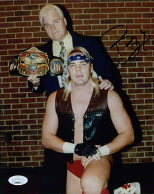 Legendary Pro-wrestler Barry Windham With Manager J.j. Dillon Wallpaper