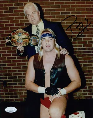 Legendary Pro-wrestler Barry Windham With Manager J.j. Dillon Wallpaper