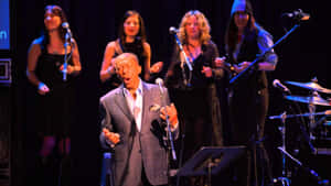 Legendary Singer Performance On Stage Wallpaper