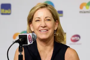 Legendary Tennis Player Chris Evert Speaking Into A Microphone Wallpaper