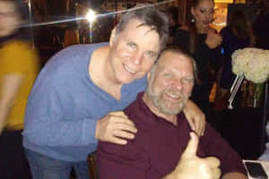 Legendary Wrestlers Jim Duggan And Lanny Poffo In Action Wallpaper