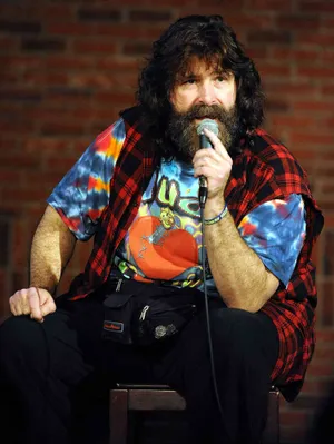 Legendary Wwe Hall Of Famer Mick Foley Delivering Engaging Comedy Chat. Wallpaper