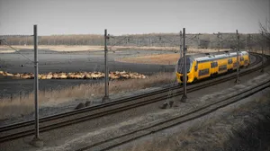 Lelystad Train Passing Through Countryside Wallpaper