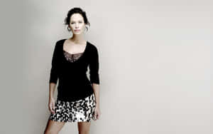 Lena Headey Smiling In An Elegant Black Dress Wallpaper