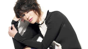 Lena Headey Striking A Pose In A Stylish Outfit Wallpaper