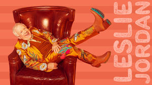 Leslie Jordan Lying On Chair Wallpaper