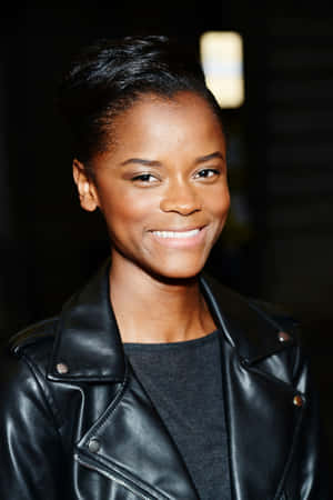 Letitia Wright Smilingin Leather Jacket Wallpaper