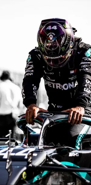 Lewis Hamilton F1 About To Sit On His Racing Car Wallpaper