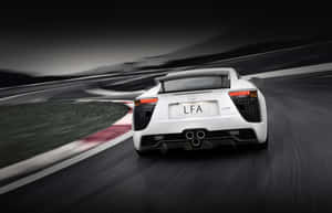 Lexus Lfa: A Luxurious Sports Car On The Road Wallpaper