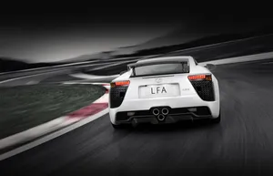 Lexus Lfa: A Luxurious Sports Car On The Road Wallpaper