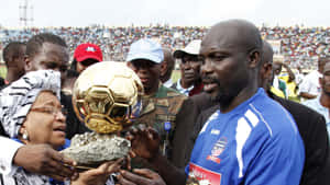 Liberian George Weah With Ballon D'or Trophy Wallpaper