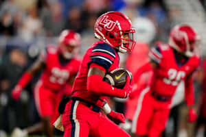 Liberty University Football Player Action Shot Wallpaper