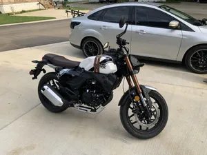 Lifan Motorcycle Parked Outdoors Wallpaper