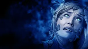 Light Bulb Illuminated With Human Eye In The Center Wallpaper