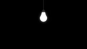 Light Bulb On Black Tablet Wallpaper